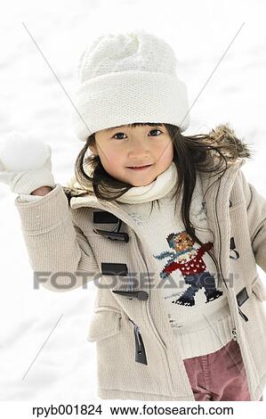 Kid playing in the snow View Large Photo Image Picture - Kid playing in the snow. Fotosearch