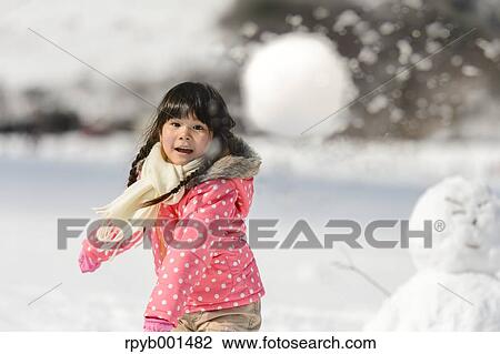 Kid playing in the snow View Large Photo Image Stock Image - Kid playing in the snow. Fotosearch