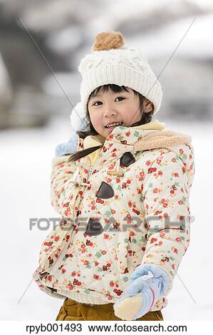 Kid playing in the snow View Large Photo Image Stock Image - Kid playing in the snow. Fotosearch