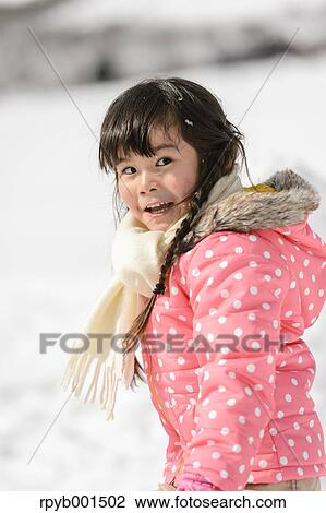 Kid playing in the snow View Large Photo Image Stock Image - Kid playing in the snow. Fotosearch