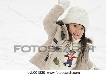 Kid playing in the snow View Large Photo Image Stock Image - Kid playing in the snow. Fotosearch