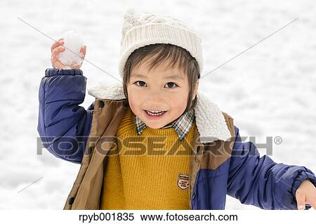 Kid playing in the snow View Large Photo Image Stock Photography - Kid playing in the snow. Fotosearch