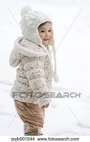 Picture - Kid playing on snow. Fotosearch