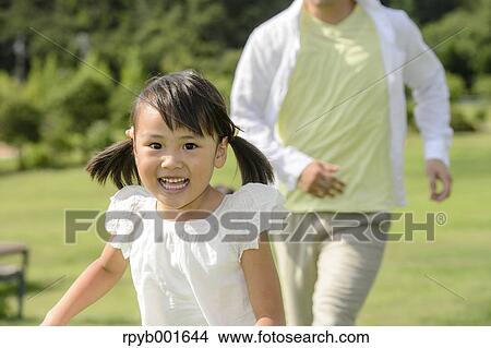 Kid with dad at the park View Large Photo Image Picture - Kid with dad at the park. Fotosearch