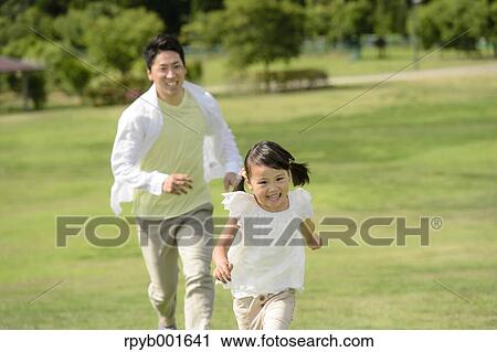 Kid with dad at the park View Large Photo Image Stock Image - Kid with dad at the park. Fotosearch