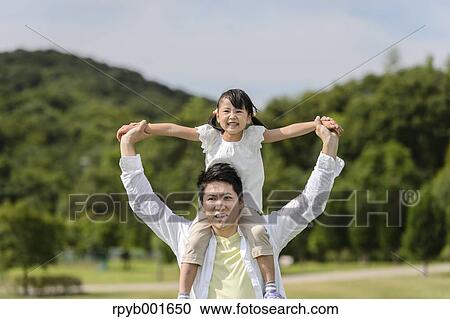 Kid with dad at the park View Large Photo Image Stock Image - Kid with dad at the park. Fotosearch