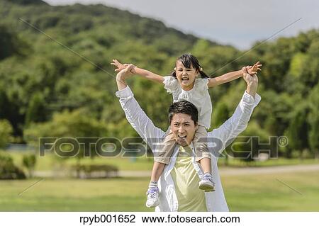 Kid with dad at the park View Large Photo Image Stock Image - Kid with dad at the park. Fotosearch