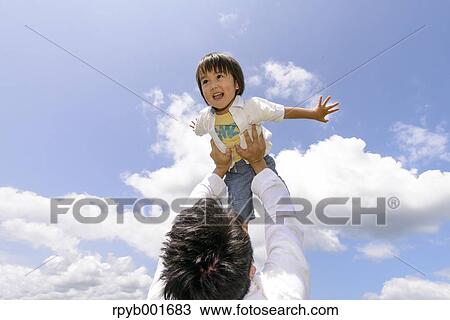 Kid with dad at the park View Large Photo Image Stock Image - Kid with dad at the park. Fotosearch