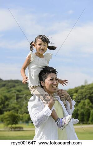 Kid with dad at the park View Large Photo Image Stock Photo - Kid with dad at the park. Fotosearch