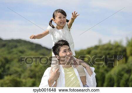 Kid with dad at the park View Large Photo Image Stock Photo - Kid with dad at the park. Fotosearch