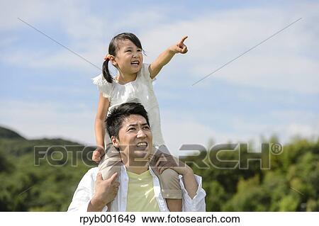 Kid with dad at the park View Large Photo Image Stock Photo - Kid with dad at the park. Fotosearch