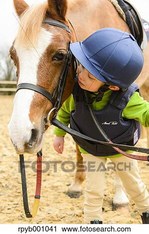 Kid with horse View Large Photo Image Stock Image - Kid with horse. Fotosearch