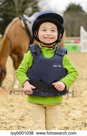 Kid with horse View Large Photo Image Stock Photo - Kid with horse. Fotosearch