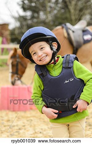 Kid with horse View Large Photo Image Stock Photo - Kid with horse. Fotosearch
