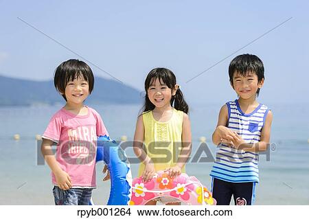 Kids at the beach View Large Photo Image Picture - Kids at the beach. Fotosearch