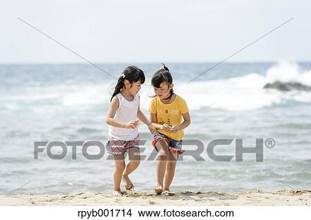 Kids at the beach View Large Photo Image Picture - Kids at the beach. Fotosearch