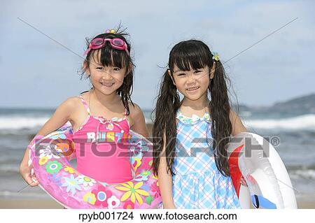 Kids at the beach View Large Photo Image Picture - Kids at the beach. Fotosearch