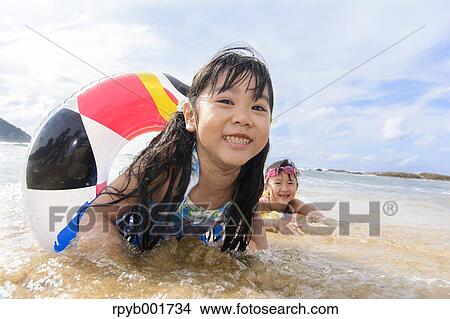 Kids at the beach View Large Photo Image Picture - Kids at the beach. Fotosearch