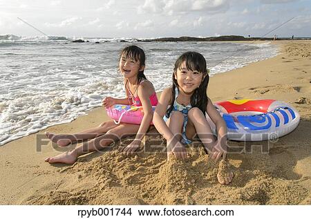 Kids at the beach View Large Photo Image Picture - Kids at the beach. Fotosearch