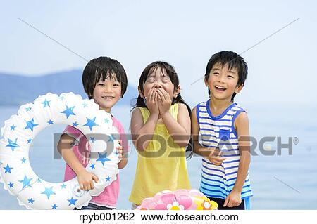 Kids at the beach View Large Photo Image Stock Image - Kids at the beach. Fotosearch