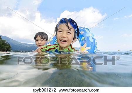 Kids at the beach View Large Photo Image Stock Image - Kids at the beach. Fotosearch
