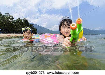 Kids at the beach View Large Photo Image Stock Image - Kids at the beach. Fotosearch