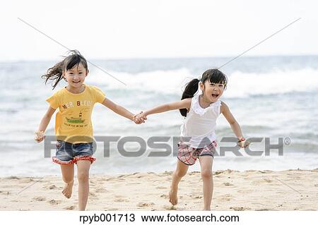 Kids at the beach View Large Photo Image Stock Image - Kids at the beach. Fotosearch