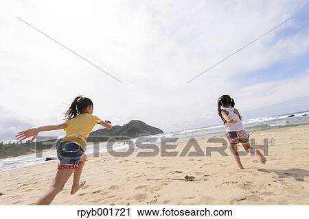 Kids at the beach View Large Photo Image Stock Image - Kids at the beach. Fotosearch
