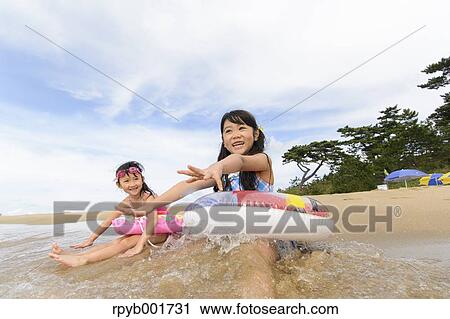 Kids at the beach View Large Photo Image Stock Image - Kids at the beach. Fotosearch