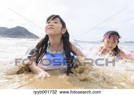 Kids at the beach View Large Photo Image Stock Image - Kids at the beach. Fotosearch