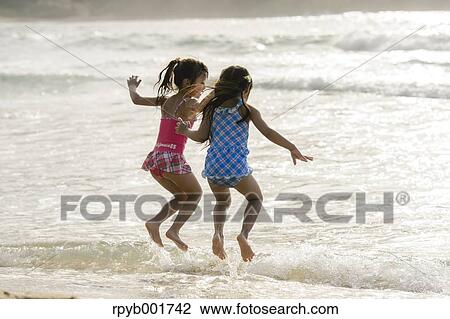 Kids at the beach View Large Photo Image Stock Image - Kids at the beach. Fotosearch
