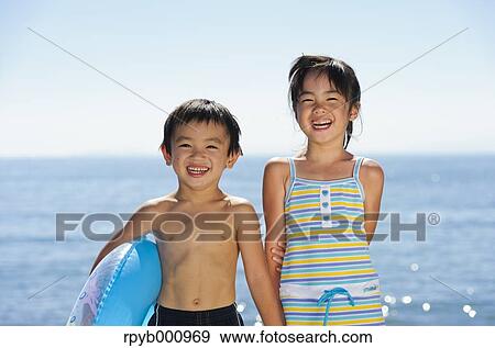 Kids at the beach View Large Photo Image Stock Photo - Kids at the beach. Fotosearch