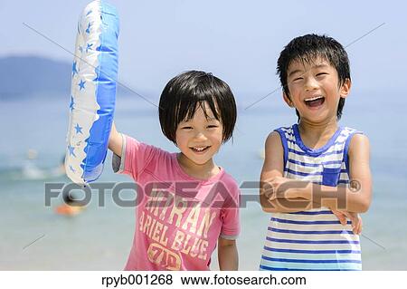 Kids at the beach View Large Photo Image Stock Photo - Kids at the beach. Fotosearch