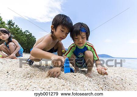 Kids at the beach View Large Photo Image Stock Photo - Kids at the beach. Fotosearch