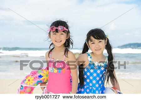 Kids at the beach View Large Photo Image Stock Photo - Kids at the beach. Fotosearch