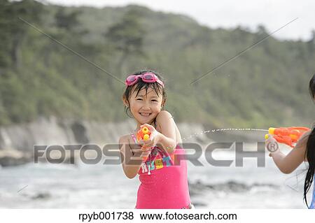 Kids at the beach View Large Photo Image Stock Photo - Kids at the beach. Fotosearch
