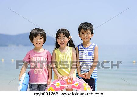 Kids at the beach View Large Photo Image Stock Photograph - Kids at the beach. Fotosearch