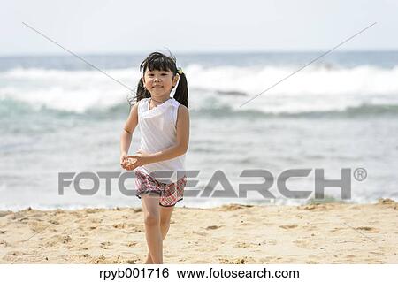 Stock Photograph - Kids at the beach. Fotosearch
