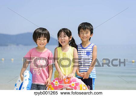 Kids at the beach View Large Photo Image Stock Photography - Kids at the beach. Fotosearch