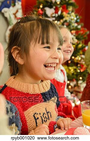 Kids eating in the house at Christmas View Large Photo Image Stock Image - Kids eating in the house at Christmas. Fotosearch
