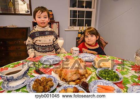 Kids eating in the house at Christmas View Large Photo Image Stock Photography - Kids eating in the house at Christmas. Fotosearch