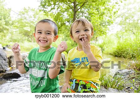 Kids playing in a city park View Large Photo Image Stock Image - Kids playing in a city park. Fotosearch