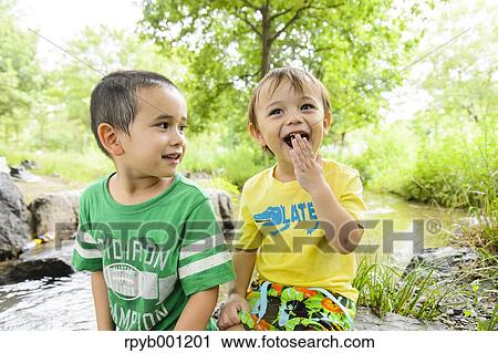 Kids playing in a city park View Large Photo Image Stock Image - Kids playing in a city park. Fotosearch