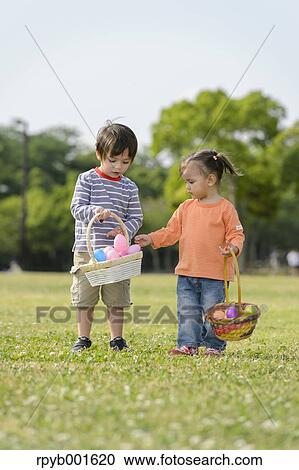 Kids playing in a city park View Large Photo Image Stock Image - Kids playing in a city park. Fotosearch
