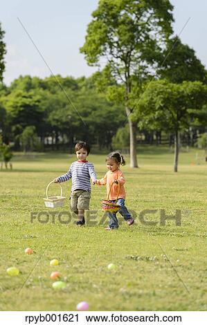 Kids playing in a city park View Large Photo Image Stock Image - Kids playing in a city park. Fotosearch