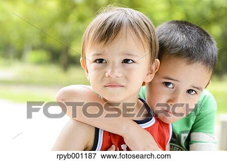Kids playing in a city park View Large Photo Image Stock Photo - Kids playing in a city park. Fotosearch