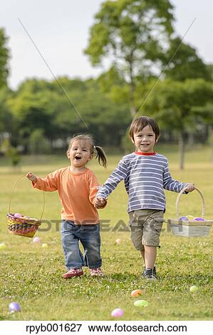 Kids playing in a city park View Large Photo Image Stock Photo - Kids playing in a city park. Fotosearch