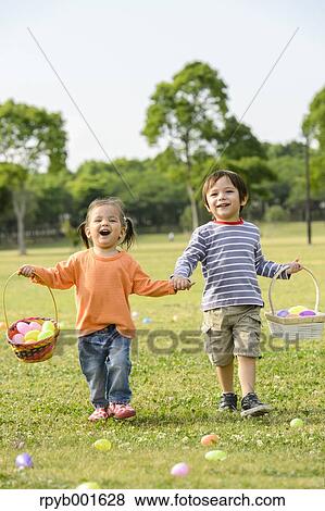 Kids playing in a city park View Large Photo Image Stock Photo - Kids playing in a city park. Fotosearch