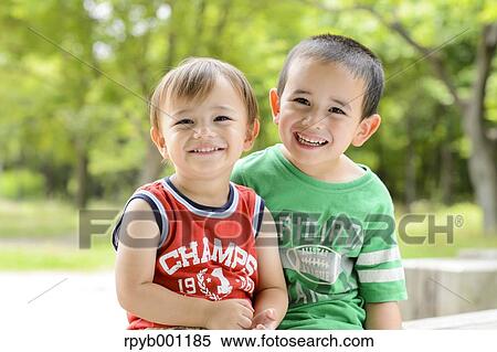 Kids playing in a city park View Large Photo Image Stock Photography - Kids playing in a city park. Fotosearch