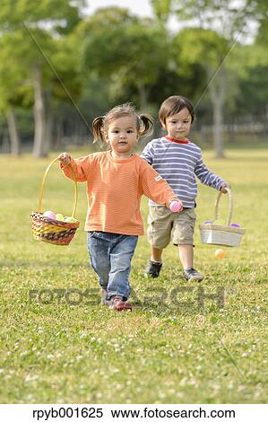 Stock Photography - Kids playing in a city park. Fotosearch